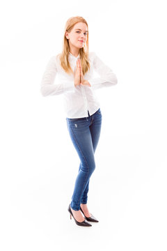 Young woman standing in prayer position