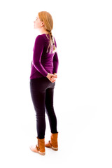 Fototapeta premium Side profile of a young woman thinking with hands behind back