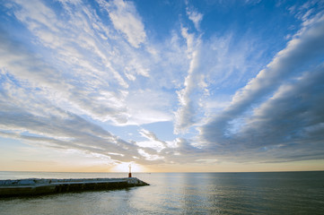 Clouds, sun and sea