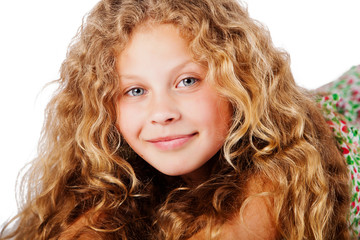 Portrait of pretty little girl with curly hair. Fashion photo