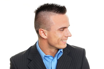 Profile of young smiling man in suit