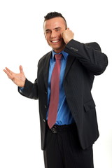 Happy man in suit talks into mobile phone