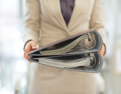 Closeup on business woman holding folders