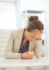 Ill business woman in office