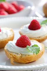 Delicious breakfast. Buttery buns with creamy cheese anf fruits