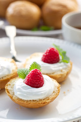 Buttery buns with  creamy cheese and fresh raspberries