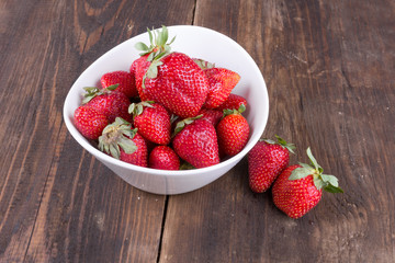 strawberries in a bowl on the table