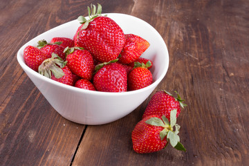 strawberries in a bowl on the table