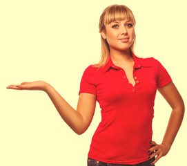 Fototapeta premium girl portrait happy young blond woman showing open hand holding