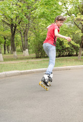 Young teenage girl skating on roller blades