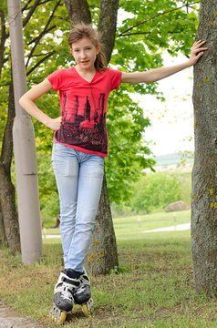 Sporty teenage girl on roller blades