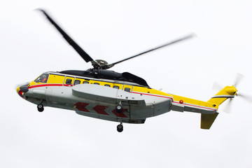 A helicopter transporting roughnecks to nearby rigs