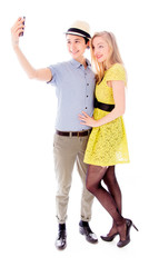 Lesbian couple taking picture of herself with a mobile phone