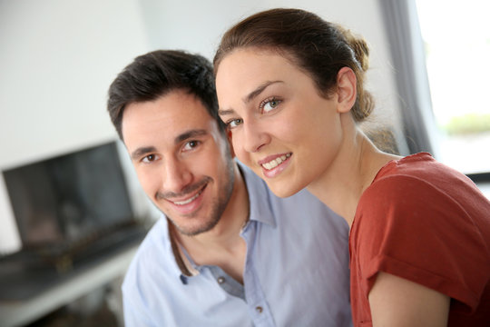 Portrait of loving couple at home