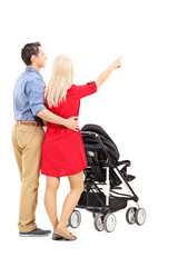 Mother and father pushing a baby stroller