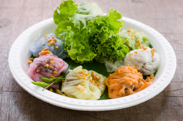 Steamed rice skin dumplings, Thai style dessert on wood table