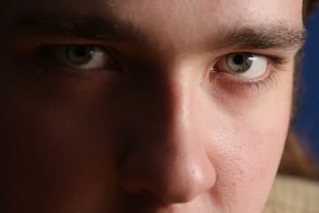 Fototapeta premium Close-up portrait of a young man looking at the camera