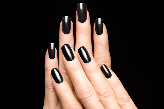 Woman hands with black nails