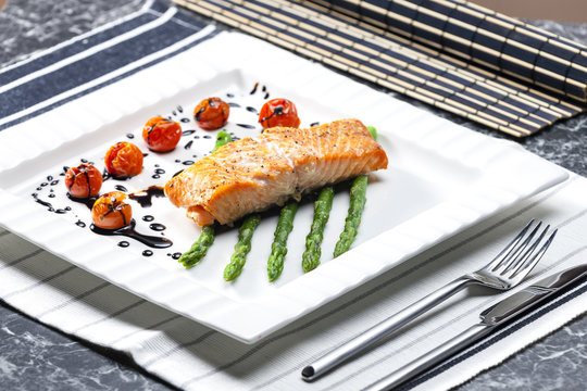 baked salmon with green asparagus and cherry tomatoes