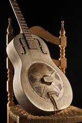 Naklejka premium resonator blues guitar on chair