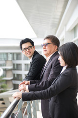 asian business team looking at somewhere