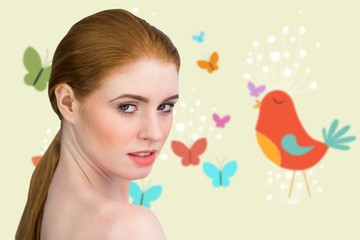Obraz na płótnie Canvas Composite image of beautiful redhead looking at camera