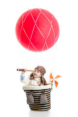 child on hot air balloon watching through spyglass