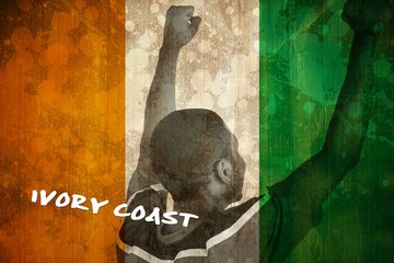 Cheering football fan in yellow jersey