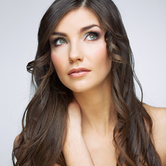 Fototapeta premium Woman face close up beauty portrait. Girl with long hair lookin