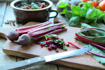 Cutting red beetroots for healthy spring soup