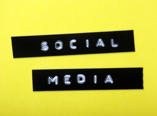 Social Media printed labels on a yellow background