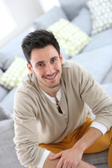 Obraz premium Portrait of young man relaxing at home