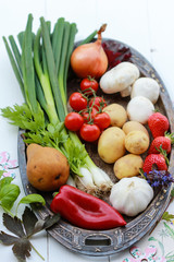 Fresh vegetables and fruits on wooden background