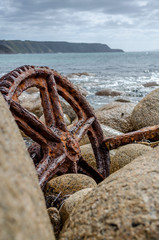 Rusty Gear between Boulders