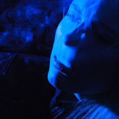 Woman with Cigarette Exhaling Smoke