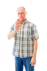 Senior man stopping with hand gesture