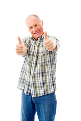 Senior man showing thumbs up gesture