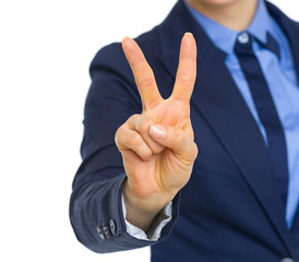 Closeup on business woman showing victory gesture