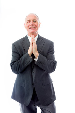 Businessman greeting with hands clasped