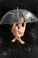  Happy girl with rain and transparent umbrella