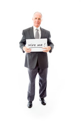 Businessman holding a message board with the text words "Hire me