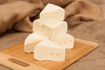 White cheese on a wooden board