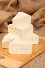 White cheese on a wooden board