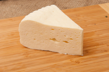 White cheese on a wooden board