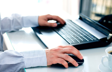 Businessman with computer in the office