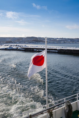 Flag of Japan, in the winter over the sea