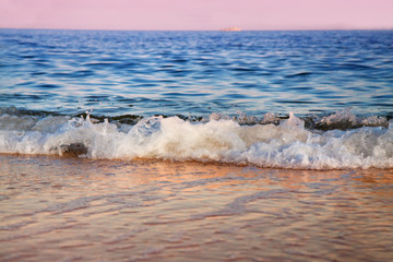 Wavy sea at sunrise