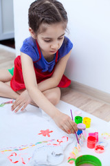 Closeup of child  painting white blouse