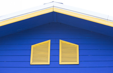 Yellow window of the blue house