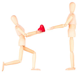 wooden Dummy holding red heart